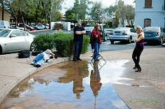  JT observes as Mike shoots Christina